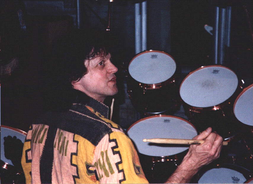 Gregg Rolie goofing around on Ron Wikso's drums at the video shoot for "Show Me The Way"